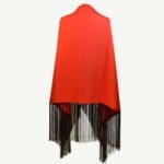 Handmade dance shawl with red fabric and black fringe.