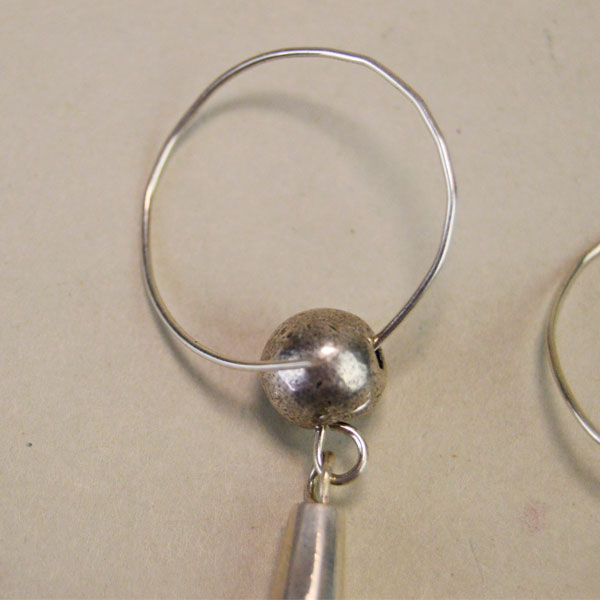 Ball and Cone Silver Earring showing opening wire