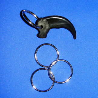 Three Key Rings placed together and one attached to imitation bear claw