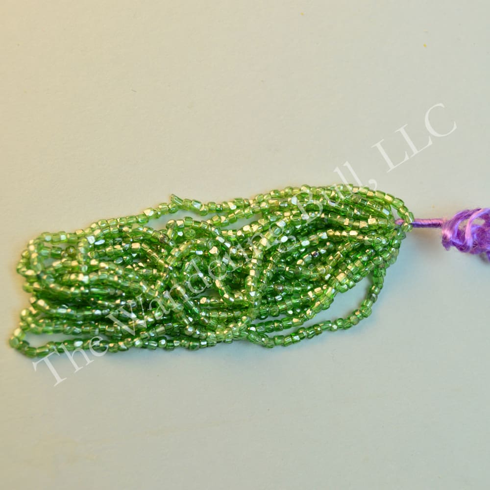 Antique Seed Bead 11/0 Translucent Light Green Cuts