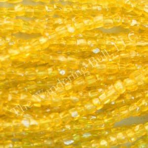 Antique Seed Bead 11/0 Translucent Yellow Cuts