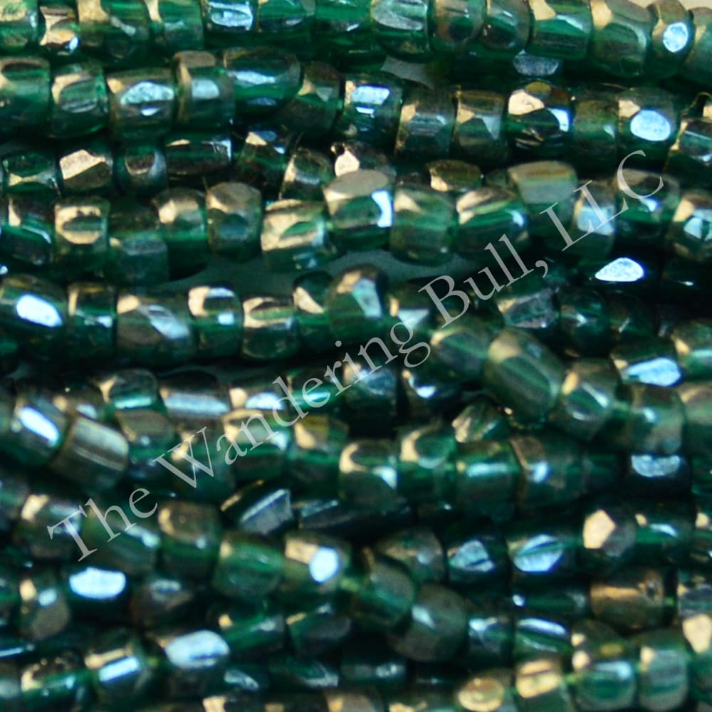 Antique Seed Bead 11/0 Translucent Teal Cuts