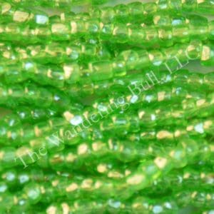 Antique Seed Bead 11/0 Translucent Mint Green Cuts