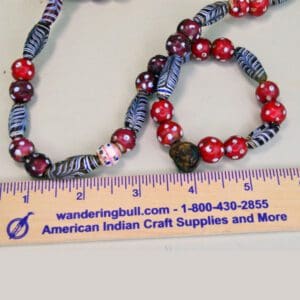 Trade Beads Red Skunk and Feather Strand