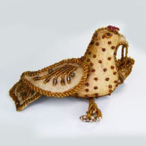 Beaded gold bird whimsey with dangles.