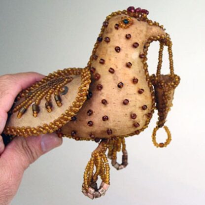 Beaded gold bird whimsey with dangles. 4