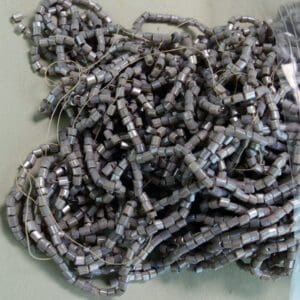 7 oz bag of smoke gray tube beads.