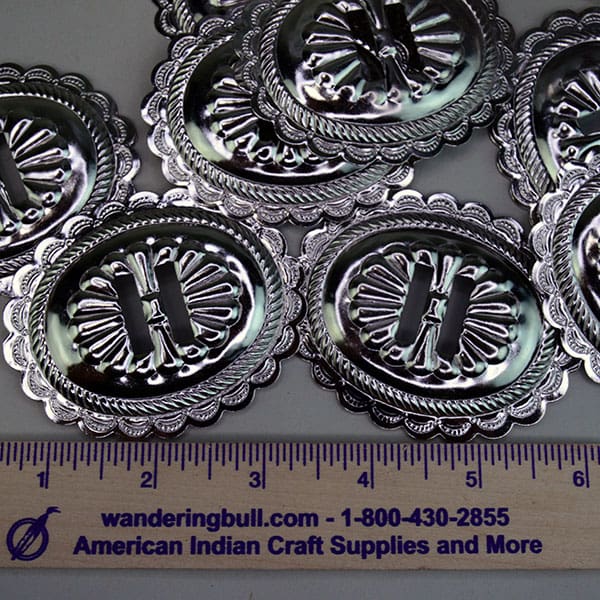 Collection of 86 large metal conchos.