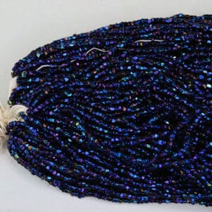 13/0 seed bead cuts in peacock blue.