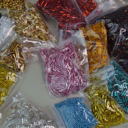 This 34 ounces of assorted Bugle Beads comes in assorted Colors and Sizes. These beads are also great for making simple bracelets. One of a Kind.