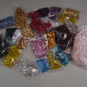 This 34 ounces of assorted Bugle Beads comes in assorted Colors and Sizes. These beads are also great for making simple bracelets. One of a Kind.