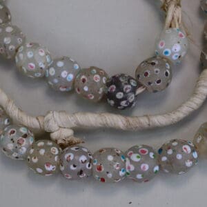 these with skunk trade beads ,have white dots with pink and turquoise dots in the white dots.