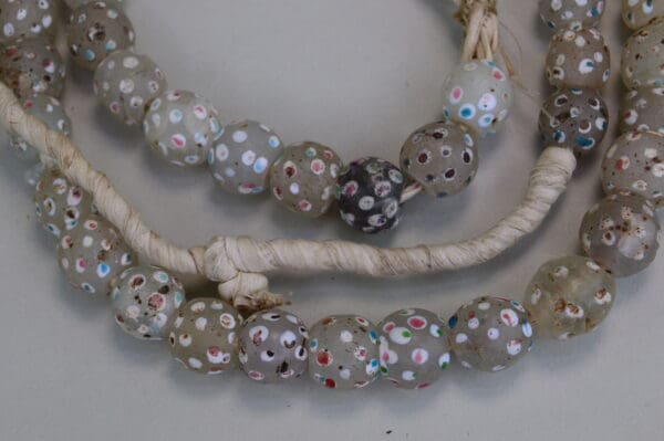 these with skunk trade beads ,have white dots with pink and turquoise dots in the white dots.