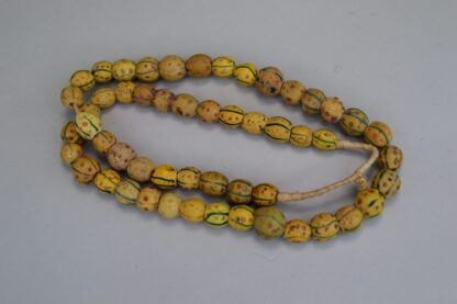 Antique Venetian Trade Beads - Fiber Strands of Venetian Mustard trade beads with green lines and red dots designs on a strand. Limited Quantities.