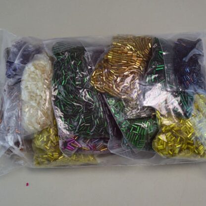 This Bugle Bead 29 ounce package are of Different Sizes and Colors. This lot would make a Great Addition to your project. One of a Kind.