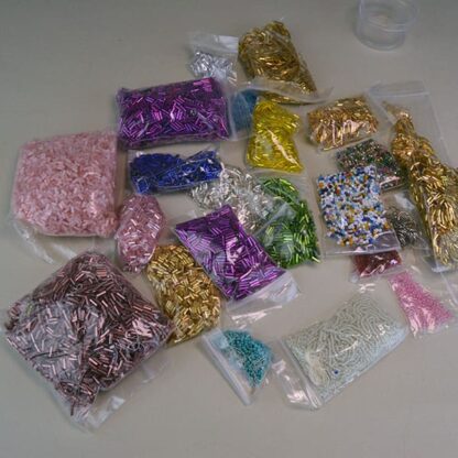 This Bugle Bead 33 Ounce package. They are of Different Sizes and Colors. This lot has a seed bead surprise . Great Addition to your project. One of a Kind