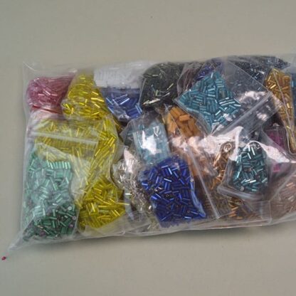 his Bugle Bead Group Lot comes in a 27ounce package. They are of Different Sizes and Colors. Great Addition to your project. One of a Kind