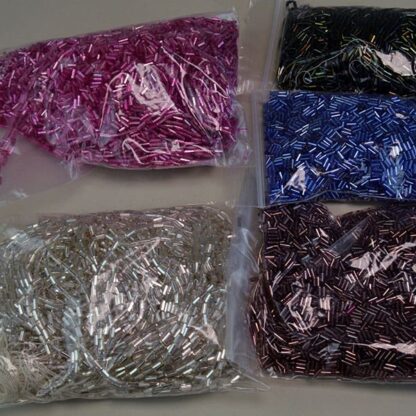 This Bugle Bead Iridescent Lot comes in a 29ounce package. They are of Different Sizes and Colors. Great Addition to your project. One of a Kind