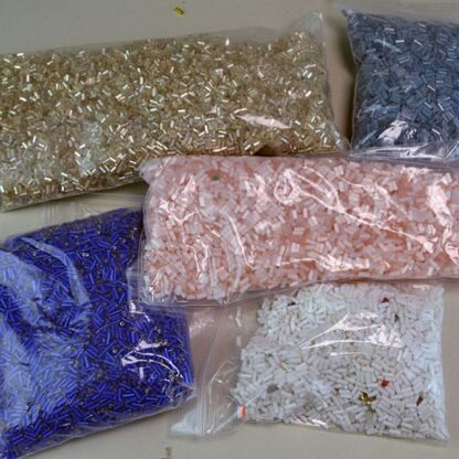 This Bugle Bead Lot comes in a 29 ounce package. They are of Different Sizes and Colors. 