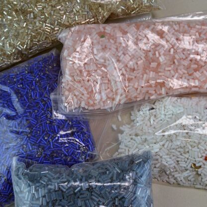 This Bugle Bead Lot comes in a 29 ounce package. They are of Different Sizes and Colors. 