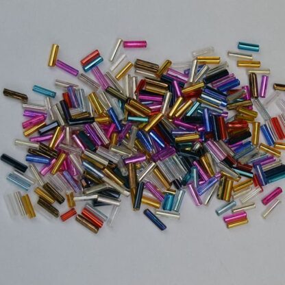 These Bugle Beads Assorted come in a 40unce package. They are mixed sizes and colors. Grab this for your next project. One of a Kind.