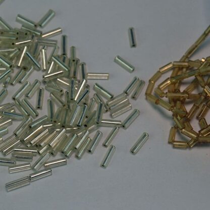 This Silver and Gold lot of Bugle Beads come in a 27 ounce package.