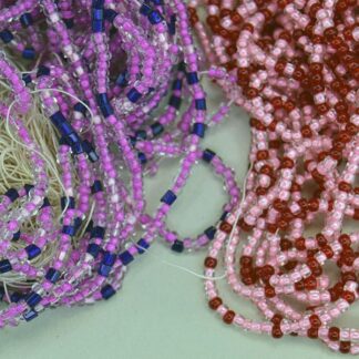 11/0 Seed Bead comes in a 16 ounce package. Colors are lined pink, light pink, fuchsia, trans red and royal blue in a tubular shape. On of a Kind.