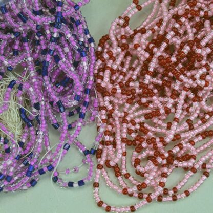 11/0 Seed Bead comes in a 16 ounce package. Colors are lined pink, light pink, fuchsia, trans red and royal blue in a tubular shape. On of a Kind.