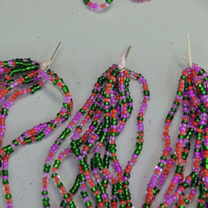 This 23 ounce Seed Bead group Lot comes in Silver Lined Dark Green, and color lined Pink and Orange. The colors are amazing together. One of a Kind