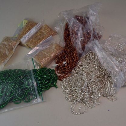 9/0 Silver Lined Seed Beads come in assorted colors in a 22 ounces package. Add sparkle and interest to your beading projects. one of a Kind.