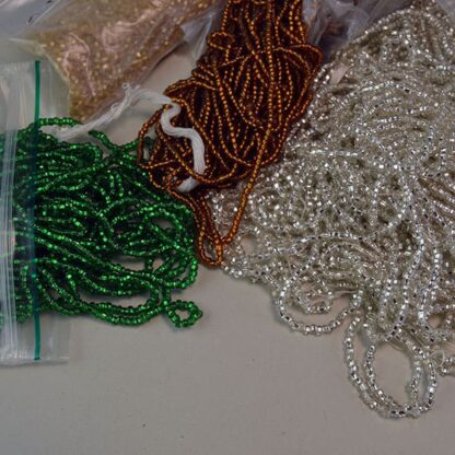 9/0 Silver Lined Seed Beads come in assorted colors in a 22 ounces package. Add sparkle and interest to your beading projects. one of a Kind.