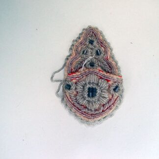 A crafter created this Antique Whimsy Watch Pocket with clear seed beads and gray basket beads on red cotton fabric. One of a Kind!