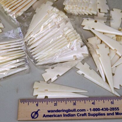 Bone Arrowhead Pendant lot will look great on necklaces, and chokers. 3" long x almost 3/4"wide. These have NO holes. 69 pieces. One of a Kind !