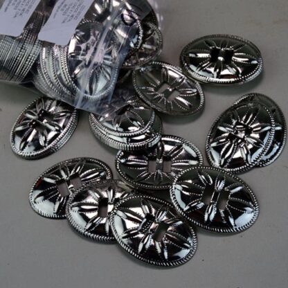 Metal Conchos Oval come in a  1.75 Inch Long x 1.5" Oval Stamped Metal Conchos with a flower design. 110 Pieces in this lot. One of a Kind !