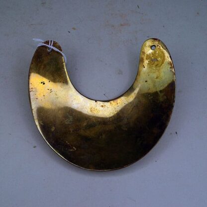 This Gorget Cast Brass Plated.  This Gorget has drilled holes. This piece measures about 5 inches across at the widest point. On of a Kind.