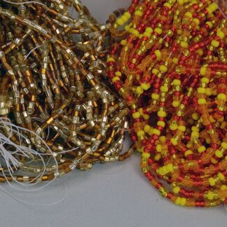 This Seed Bead 17 Ounces Lot in yellow Amber, trans red, color lined Pink, silver lined trans Red, Orange/gold, Yellow, Tubular Silver Lined gold and Amber.