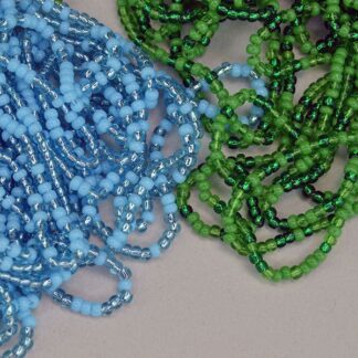 Seed Beads 11/0 Green and Blue lot. They come in a Light Blue , Trans Green , Green, a silver lined light Blue, and a dark Green. 11/0, 14 oz package.