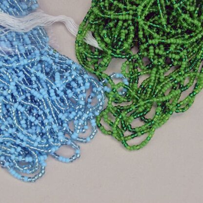 Seed Beads 11/0 Green and Blue lot. They come in a Light Blue , Trans Green , Green, a silver lined light Blue, and a dark Green. 11/0, 14 oz package. One of a Kind.