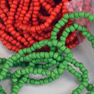 Vintage Beads from Hong Kong, color are Red and Green. This lot of Beads are not Uniform in Size. They come in a 18 ounce package. One of a Kind.