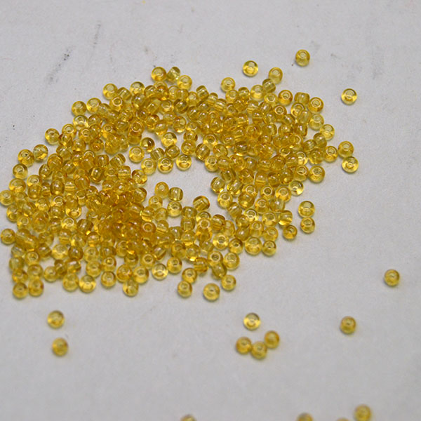 Elevate your beadwork with these Seed Beads Transparent Amber 12/0. Made in France and packaged in a generous 1 kilo. One of a Kind!