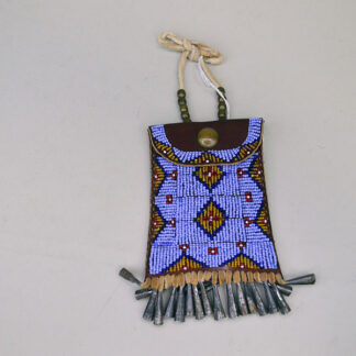 Add this fully beaded Periwinkle Strike-a-Lite bag to your collection. The bag measures 3″ wide and 5.5″ long, including the tin cones. One of a Kind,