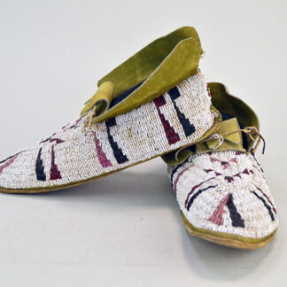 Add these fabulous Moccasins Antique Cheyenne Style to your collection! 10″ long x  3.5″ at the widest point, and stand approx. 4″ high. one of a Kind.