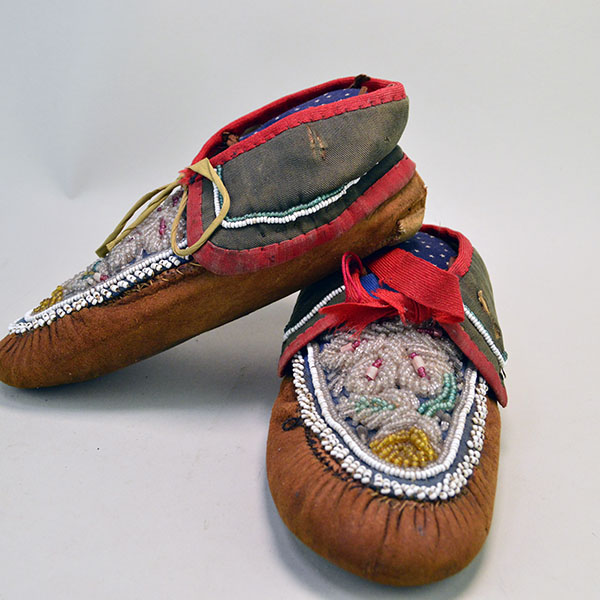 Add these Early 20th Century Moccasins- Antique Iroquois Style to your collection. classic Iroquois raised Floral beadwork design on vamps. One of a Kind