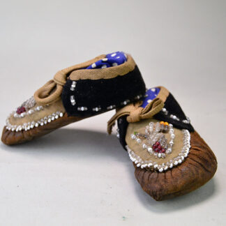 Add these Moccasins- Child's Antique Iroquois Style to your collection.   The crafter created the classic Iroquois raised beadwork design. One of a Kind.
