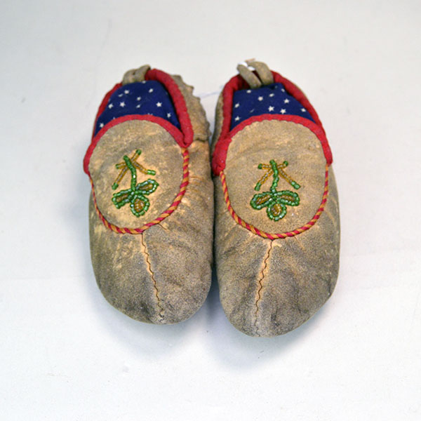 The crafter made these vintage Moccasins- Child's Cree Style in the 1960s using brain-tanned deer hide, with floral beaded design, one of a Kind.