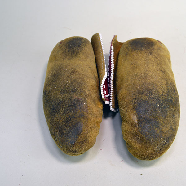 Pictured here are the soles of Eastern Woodland-style moccasins, hand-sewn with sinew and fully lined in red woo