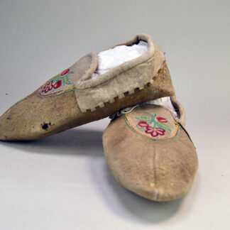 Add these Vintage Moccasins- Silk Embroidered Vamps Cree Style in the 1950s. They measure 9″ long , 3.5′ wide and 3″ high. One of a Kind.