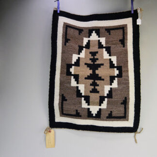This finely crafted Rug- Wool Two Grey Hills in the Navajo style. Measuring approximately 20" long by 20"  wide. One of a Kind.