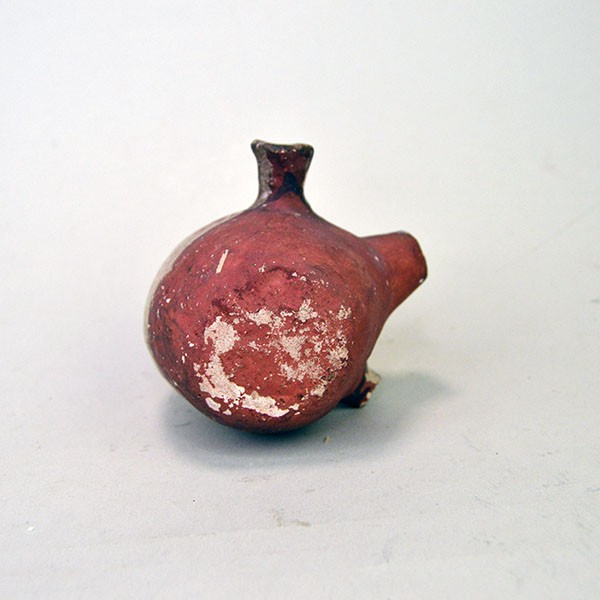 Back view of small canteen Acoma style decorated with floral design on one side and red on the other.