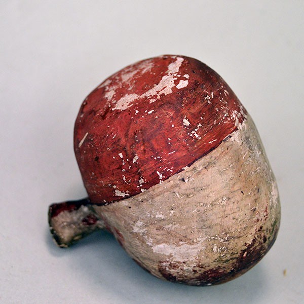 Bottom view of small canteen Acoma style decorated with floral design on one side and red on the other.
